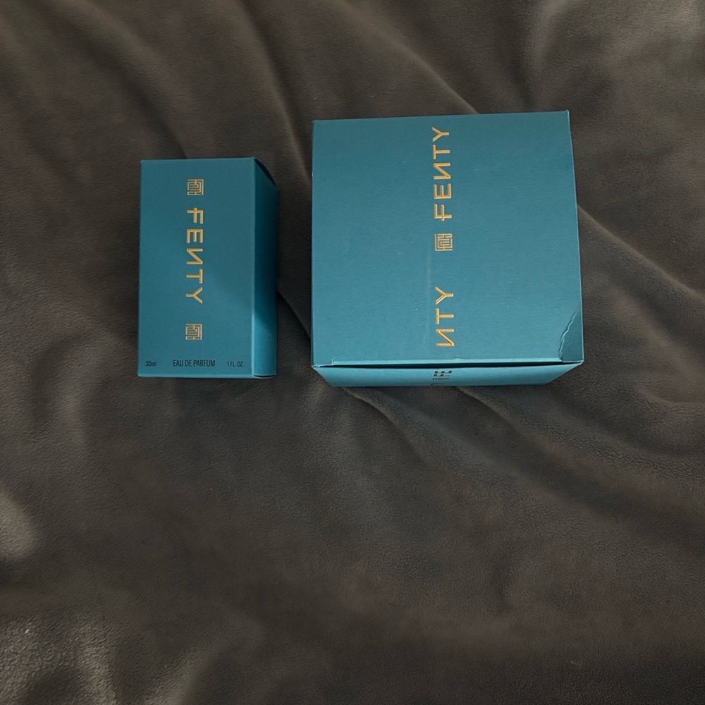 Fenty Beauty Blue and Gold perfume and scented moisturizer